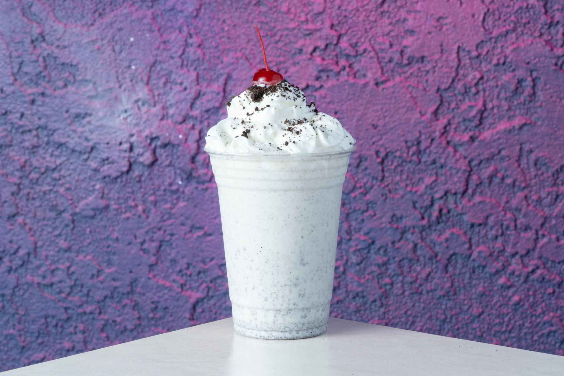 Space Dogs Oreo crumble milkshake topped with whipped cream and a cherry