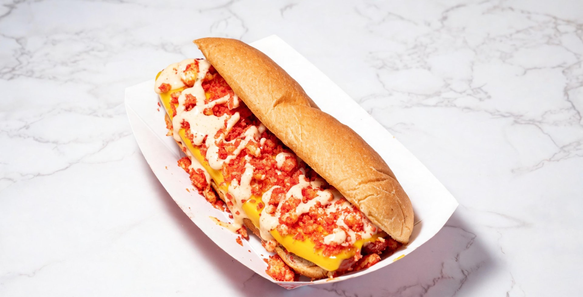 Hot dog loaded with flaming hot chip crumble, jalapeños and spicy sauce
